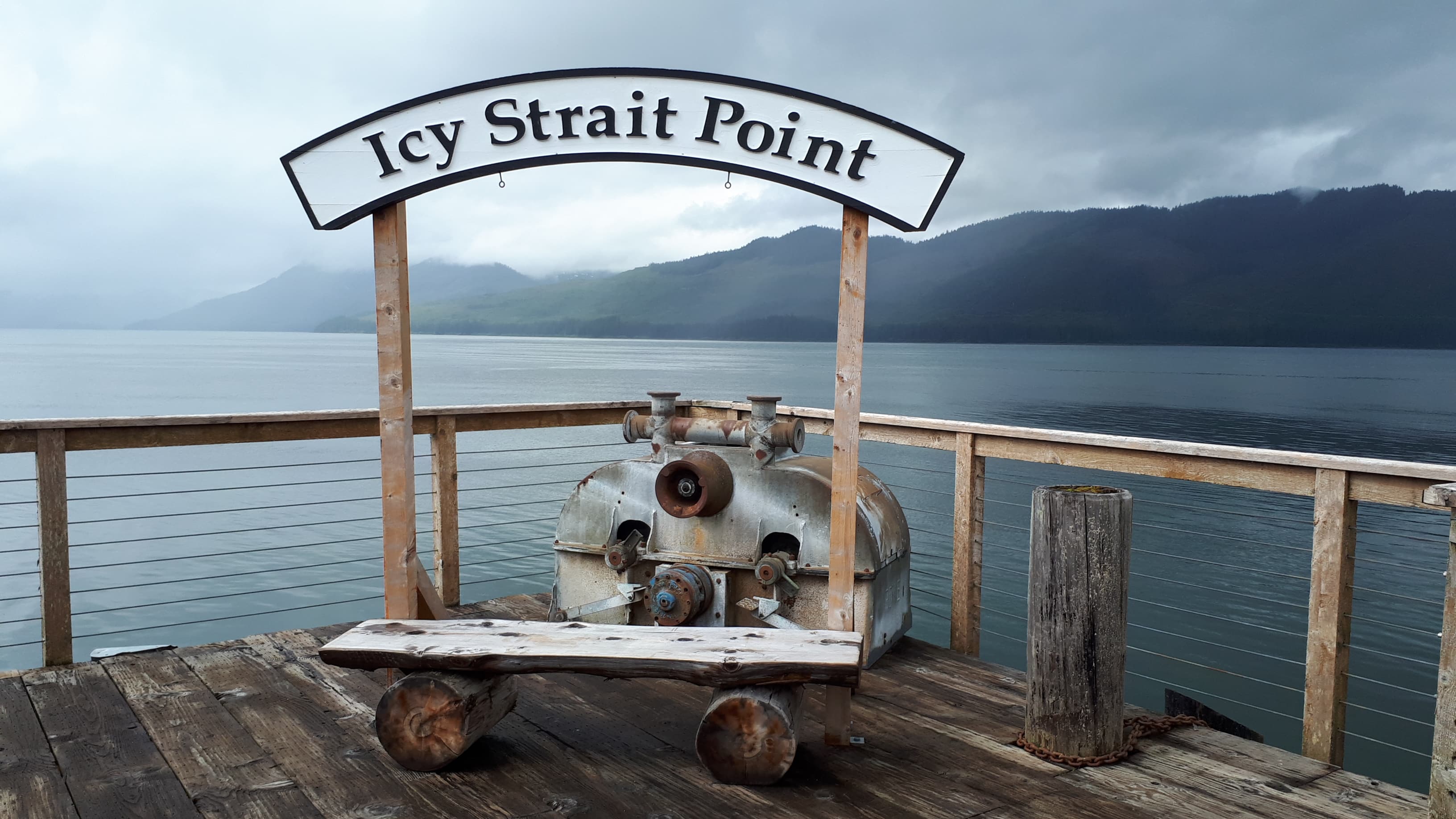 Icy Strait Point pier and forested waterfront in Alaska.