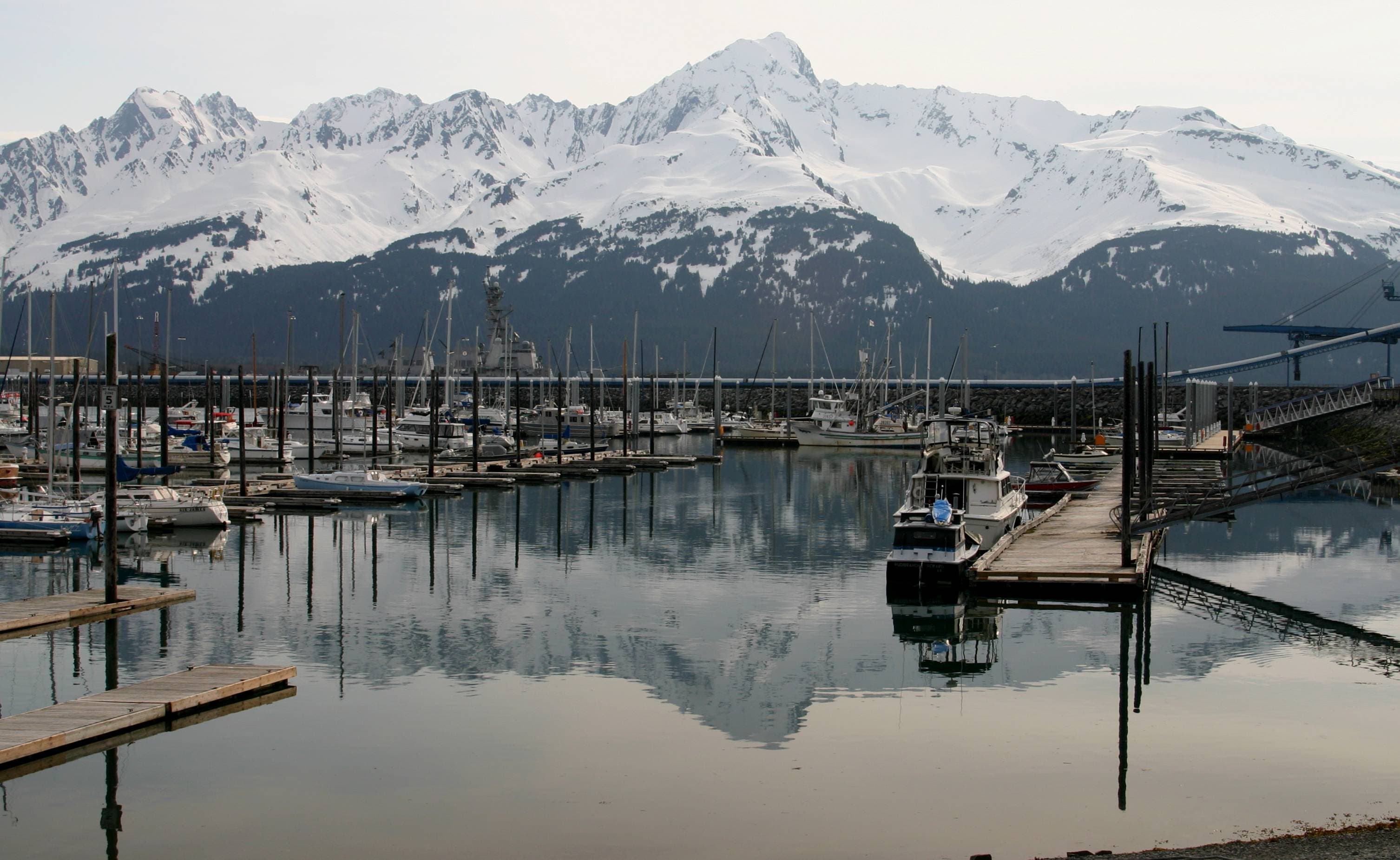 Seward harbor with boats and mountains around Resurrection Bay.