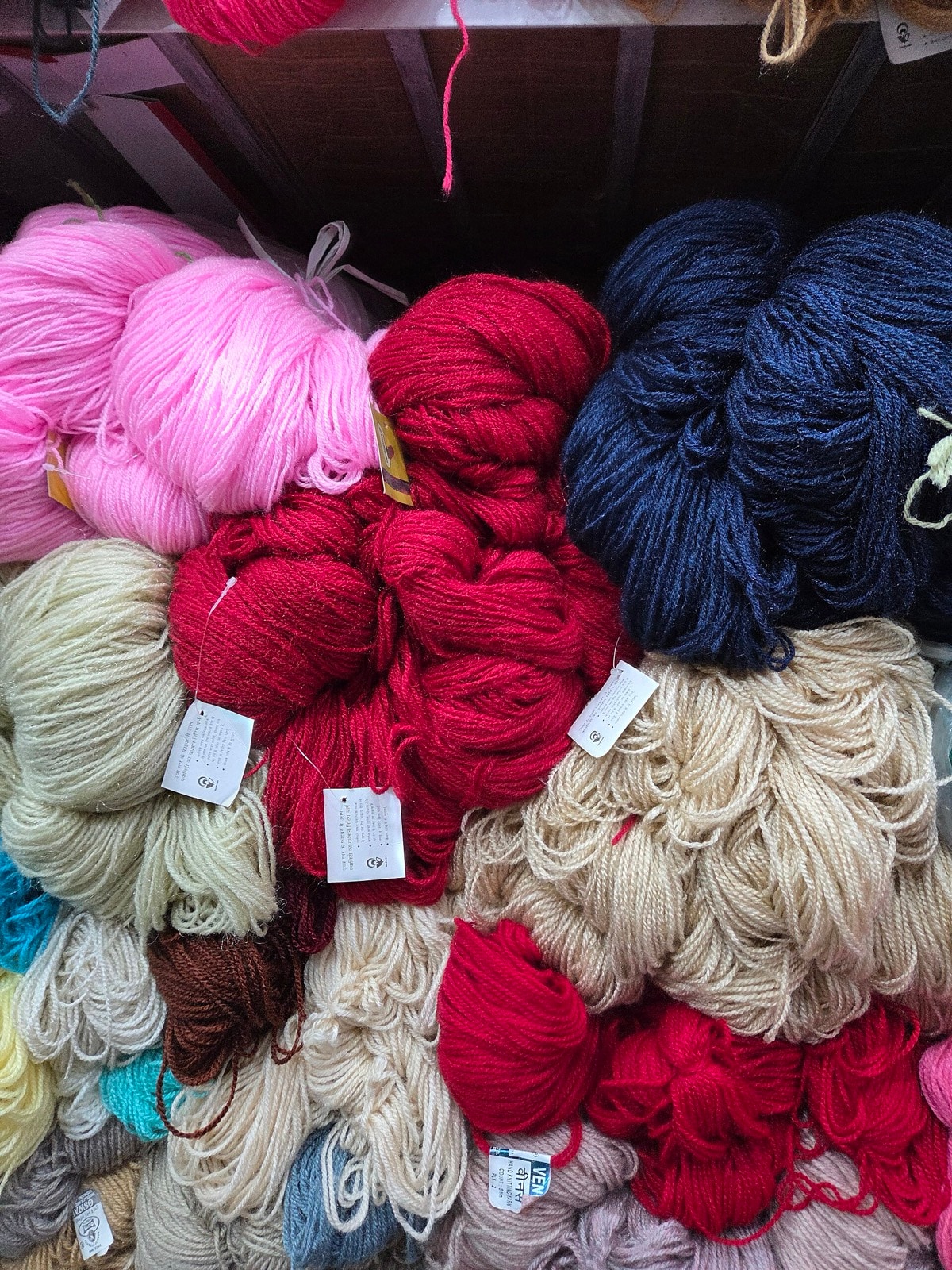 Colorful skeins of yarn used as representative stock imagery; not the Harrisville Designs Retail Store interior.